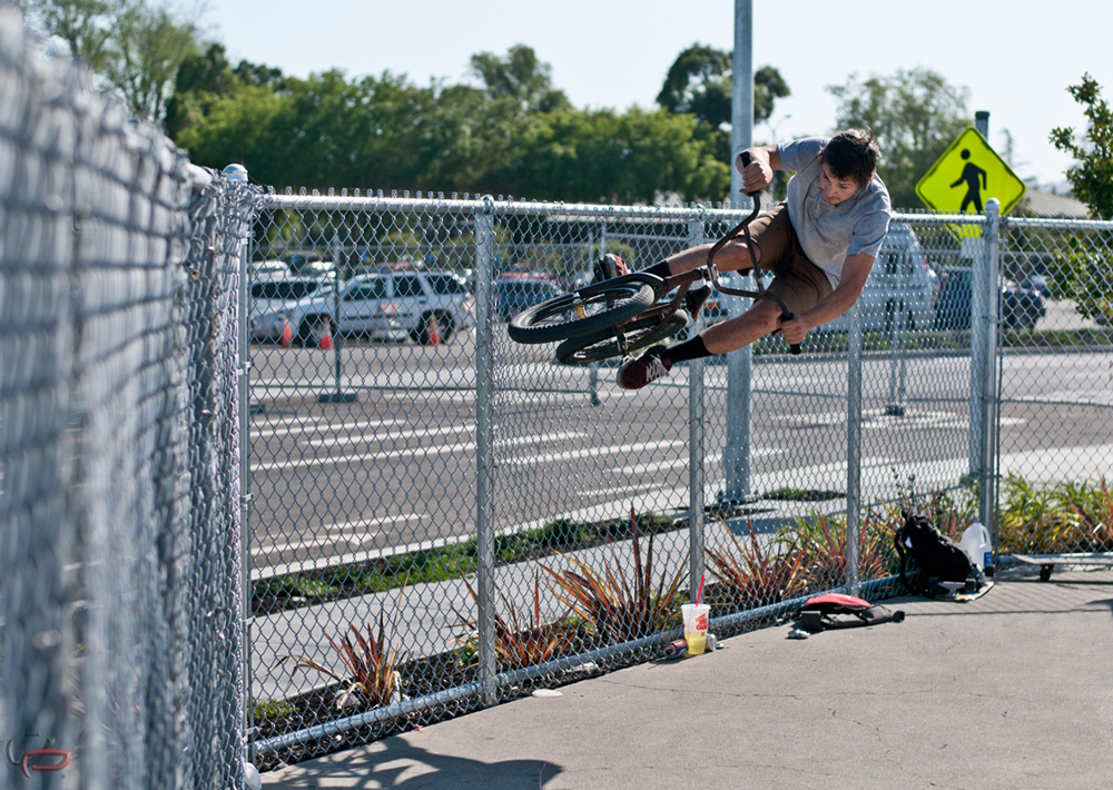 Aron Brewer banggin out a fence ride from the mini bowl lip , about 8 ft gap.