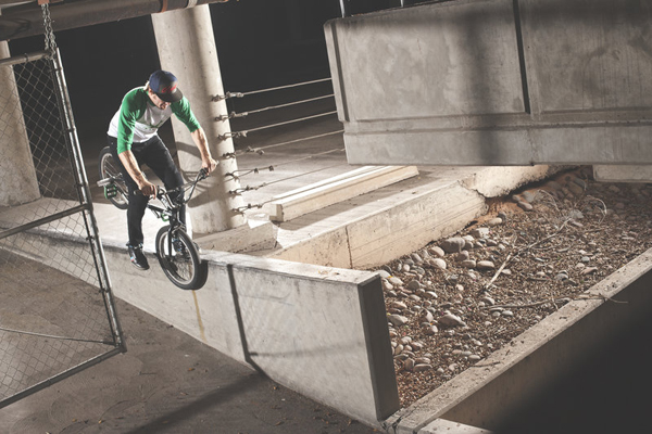 bmx-rider-adam-banton-does-a-hang-5-grind-on-a-ledge-in-2012_600x